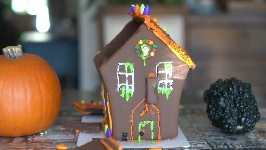 Destroying gingerbread house with hammer, taking apart gingerbread house Royalty-Free Stock Footage #1110626487