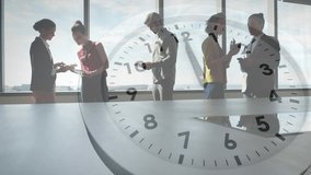 Animation of ticking clock against view of businesspeople discussing at office. Business working hours and time management concept - Powered by Shutterstock - Get 15% off with code: PIKWIZARD15