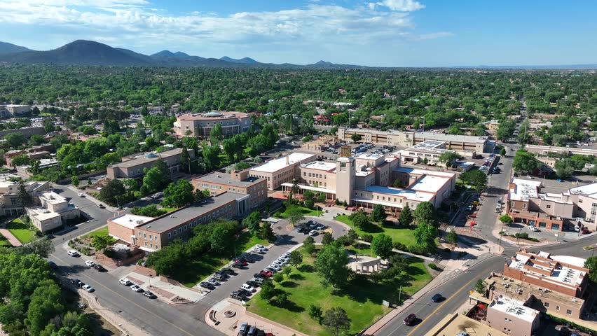 Government buildings in downtown Santa Fe, New Mexico. State Capitol grounds. Aerial establishing shot on summer day.