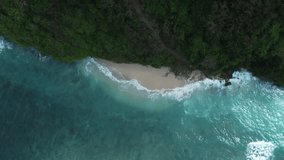 Aerial 4K Drone Footage: Discover Bali's Best-Kept Secret, Green Bowl Beach; Serene Tropical Paradise with Secret Caves, Golden Sands, and Turquoise Waves; Perfect for Nature and Adventure Videos