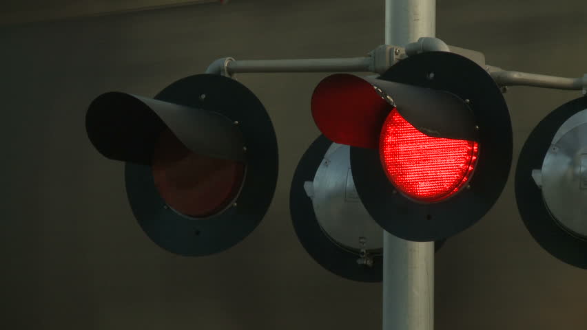 Flashing signals at a level railway crossing