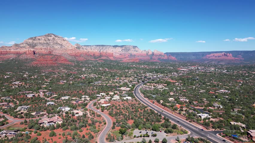 Aerial view of Sedona, arriving via 89A West revealing the red rock county