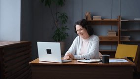 Happy middle aged senior woman sit with laptop talk on video call with friends family. Laughing mature old senior grandmother having fun talking speaking with grown up children online - Powered by Shutterstock - Get 15% off with code: PIKWIZARD15