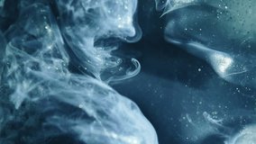 Vertical video. Color smoke background. Ethereal wave. Blue teal green shimmering glitter paint flow spreading in water hypnotic mysterious magic abstract art. - Powered by Shutterstock - Get 15% off with code: PIKWIZARD15