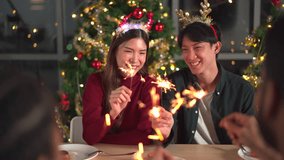 Group of diverse ethnicity young people enjoy celebrating a Christmas and New Year party together with a lot of foods and drinks. Friends celebrate Christmas and New Year festival and drink a wine. - Powered by Shutterstock - Get 15% off with code: PIKWIZARD15
