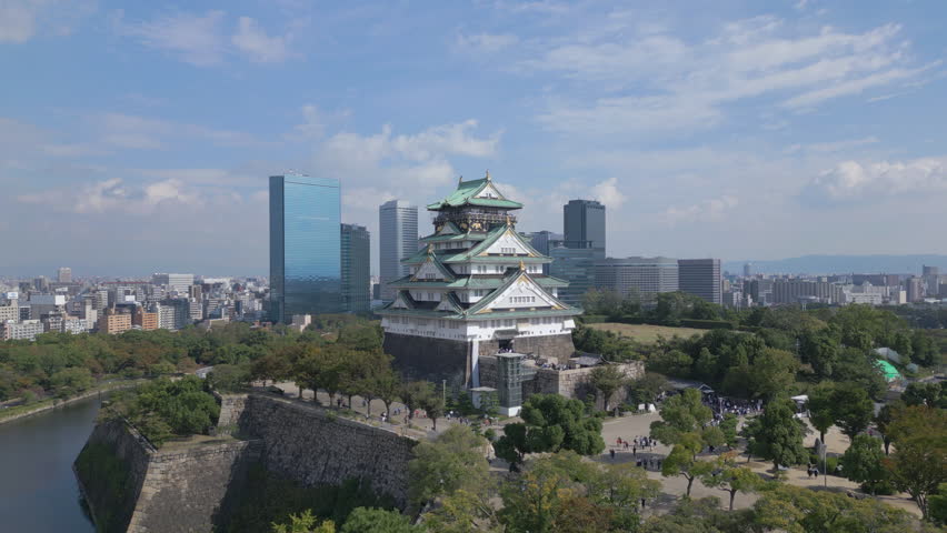 alt Rising view of Osaka Castle with Osaka skyline in background Royalty-Free Stock Footage #1110651019