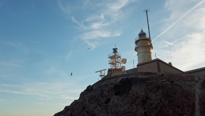 Looking Up At Cabo de Gata Lighthouse On The Coast Of Alboran Sea In Almeria, Spain. low angle