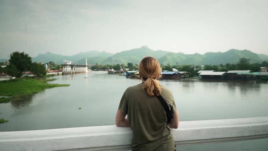 Female Tourist Traveler Looking Over The Khwae Yai River In Kanchanaburi, Thailand Royalty-Free Stock Footage #1110654791