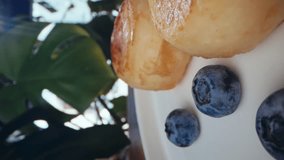 Background vertical video of dessert with cheese and berries on the table in a plate. Delicious baked sweets for breakfast. High quality 4k footage