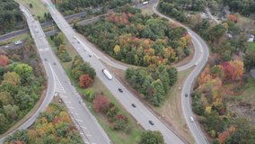 Drone footage over Donald Lynch Boulevard and Route 495 in Marlboro, Massachusetts. On off ramps and overpass visible.
