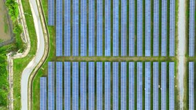 A mesmerizing drone perspective reveals a high-tech solar farm, sleek and efficient, powering the future with sustainable energy. Clean power from nature's gifts: Renewable energy.
