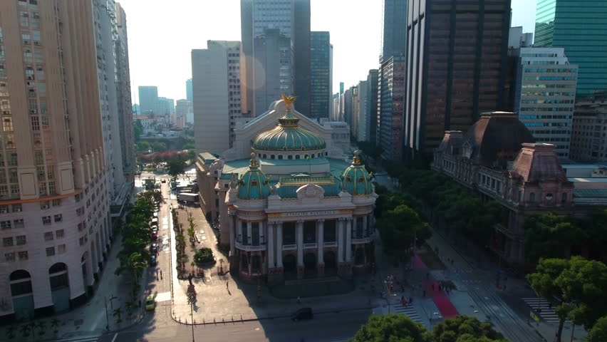 Aerial Forward Shot Of Theatro Municipal Amidst Streets And Buildings In City Against Sky - Rio de Janeiro, Brazil