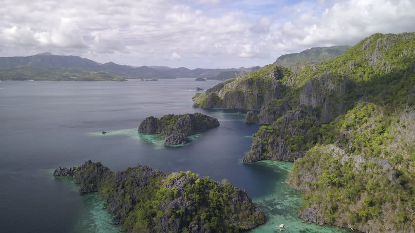 Aerial Time Lapse Shot Of Scenic Mountain By Ocean Against Cloudy Sky, Drone Flying Forward Over Sea - Hong Kong, China