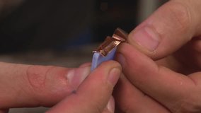 designer, the decorator glues copper tape to the edges of the polished glass, so that he can then join the pieces into a stained glass window with tin and a soldering iron - Powered by Shutterstock - Get 15% off with code: PIKWIZARD15