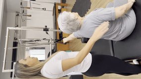 Female Trainer Aiding Senior Patient During Physical Therapy Session
. Vertical Video