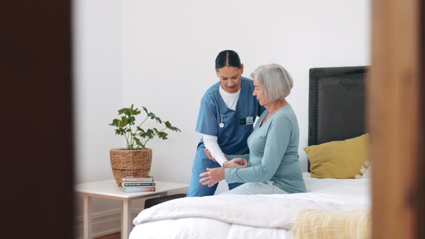 Nurse, walking and helping senior woman from bed in retirement, nursing home or healthcare. Caregiver, support or elderly person in bedroom with mobility care for arthritis, osteoporosis or balance