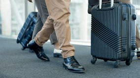 Business people, suitcase and and feet walking of staff at airport for travel and work conference. Group shoes, traveling bags and luggage for journey and trip for seminar and convention with legs - Powered by Shutterstock - Get 15% off with code: PIKWIZARD15