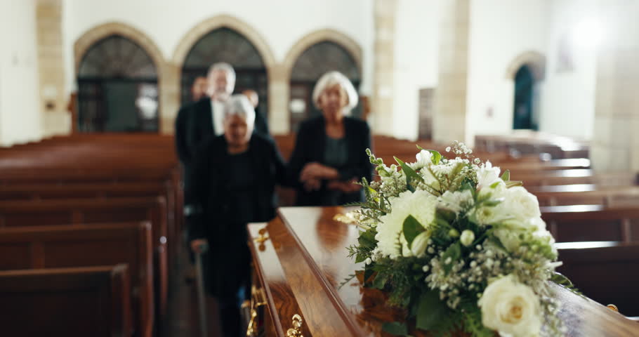 Funeral, church and people with coffin for goodbye, mourning and grief in memorial service. Depression, family and sad senior women with casket in chapel for greeting, loss and burial for death Royalty-Free Stock Footage #1110679569