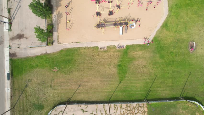 Aerial footage of Holliston, Saskatoon, SK, showcasing its residential harmony, well-planned streets, and community parks. A snapshot of tranquil suburban life, perfect for real estate.