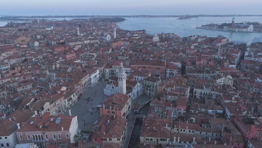 Aerial circling the Santa Maria Formosa Church and Square in Venice Italy with San Giorgio Maggiore in the bakcground