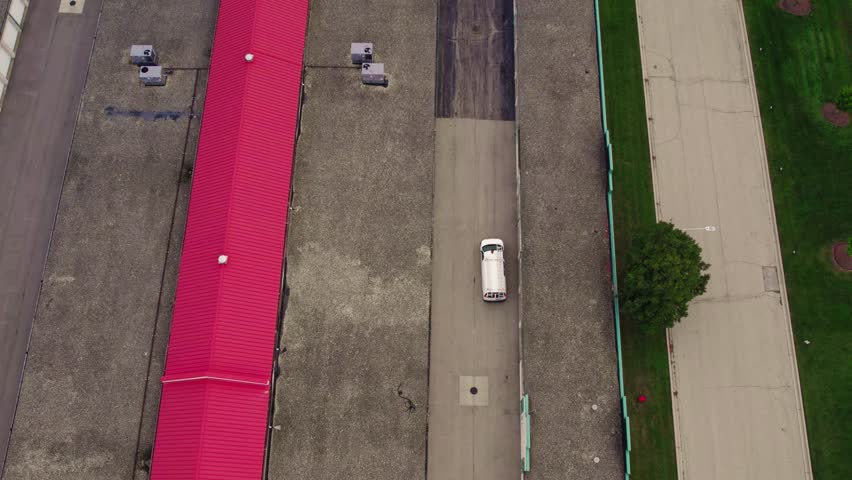 Van after loaded with goods is driving out on a public storage rental facility