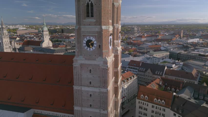The drone aerial view of The Frauenkirche and downtown district of Munich, Germany.  Munich Frauenkirche is one of the city's most famous landmarks. Royalty-Free Stock Footage #1110688361