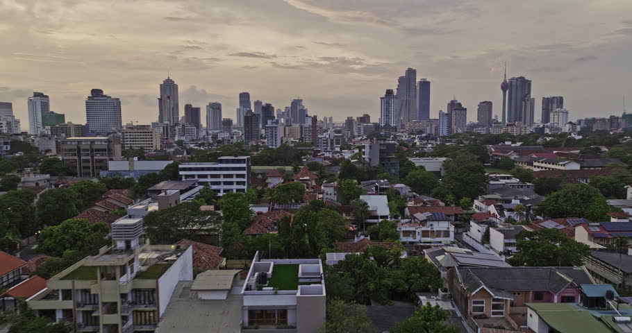 Colombo Sri Lanka Aerial v30 low flyover Bambalapitiya and Kollupitiya neighborhoods capturing upscale homes and downtown cityscape of Wekanda and Fort at sunset - Shot with Mavic 3 Cine - April 2023