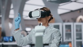 Virtual headset bioengineer researching augmented reality in futuristic medical laboratory close up. Woman lab worker using vr goggles in science clinic. Scientist working in hi-tech neuroscience. - Powered by Shutterstock - Get 15% off with code: PIKWIZARD15