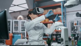 Vr glasses doctor controlling augmented reality simulation making research in modern laboratory closeup. Woman scientist moving invisible interface with hands. Researcher in goggles working cyberspace - Powered by Shutterstock - Get 15% off with code: PIKWIZARD15