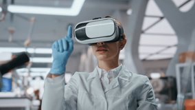 Glasses scientist using virtual reality working at science experiment in innovation laboratory close up. Woman microbiologist in vr goggles touching invisible interface. Lab doctor making research. - Powered by Shutterstock - Get 15% off with code: PIKWIZARD15