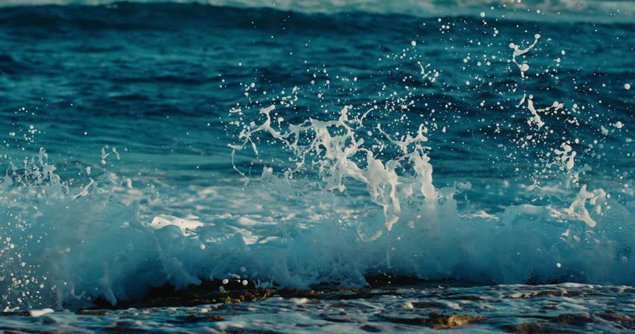 Super slow motion view of ocean wave crashing into the shoreline at 10000 fps | Shutterstock HD Video #1110694415