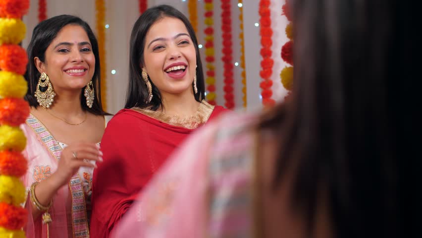 Two close friends dressed in traditional Indian attire are getting ready for Diwali celebration. Two beautiful women in ethnic clothing - Diwali festival, festive vibe, Hindu festival, Onam, Asian 