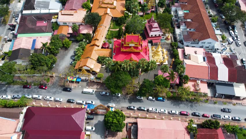 Vibrant colours around a Burmese temple in the city of Penang. Aerial