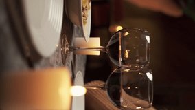 Close up of young couple celebrating Valentine's Day and toasting with glasses of red wine at restaurant - Powered by Shutterstock - Get 15% off with code: PIKWIZARD15