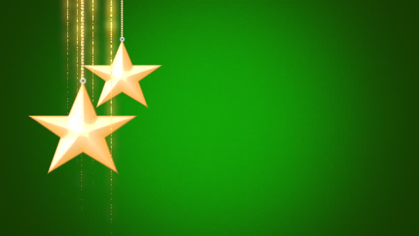 Two glowing gold stars hang against a reflective green backdrop. The stars' brilliance illuminates their golden hue, while the green background adds a radiant touch Royalty-Free Stock Footage #1110715627