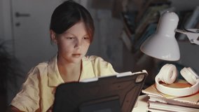 Distant School Learning Concept. Girl Uses Tablet Computer