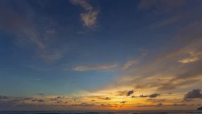 Time lapse stunning clouds float above the sea as the sun sets..scenery The beauty of the sky was mesmerizing in stunning sunset.Gradient color..Sky texture, abstract nature background..