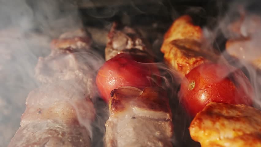 Chicken, meat and liver kebabs are fried on an open grill with charcoal Royalty-Free Stock Footage #1110722223