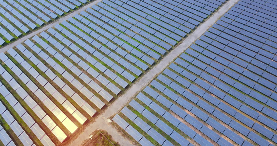 Solar panel park electric power energy power Aerial view footage top down camera of solar panel sunshine reflection on solar panel drone flying mover cinematic scene over solar park DCI 4K ProRes 422