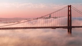 Breathtaking views on major USA landmark. Tourism background. Epic landscape with cinematic pink clouds floating around scenic red Golden Gate bridge with San Francisco cityscape on motion background - Powered by Shutterstock - Get 15% off with code: PIKWIZARD15