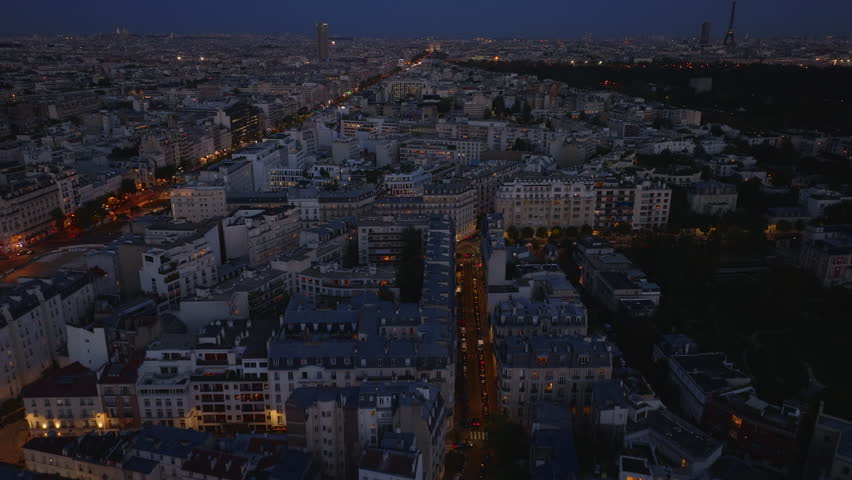 High angle view of blocks of apartment building in residential urban borough in evening city. Paris, France Royalty-Free Stock Footage #1110728563