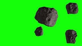 Asteroids in space. Five asteroids fly slowly from right to left  of a green screen animation. Realistic animation of asteroid on green background. 4K video.
