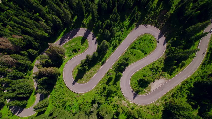 Aerial shot of the Serpent Road. A winding route with very tight curves. A paradise for motorcyclists surrounded by tall mountain trees
