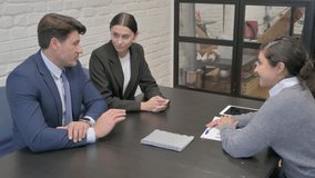 Businessman Talking with Business Partners in Meeting