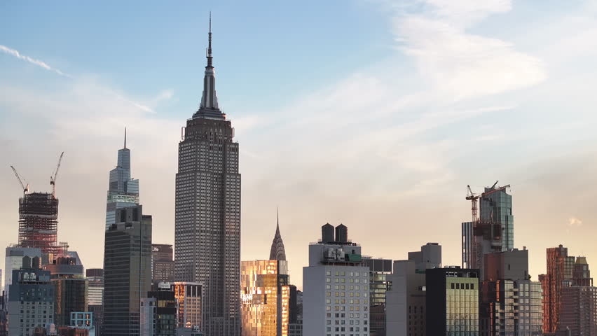 Aerial view of New York City's Empire State Building at sunrise. Shot in Midtown Manhattan during the autumn of 2023 in 4k. Royalty-Free Stock Footage #1110737095