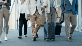 Business team, suitcase and feet walking of staff shoes at airport for travel and work conference. Group, traveling bags and luggage for journey and trip for global seminar and convention with legs - Powered by Shutterstock - Get 15% off with code: PIKWIZARD15