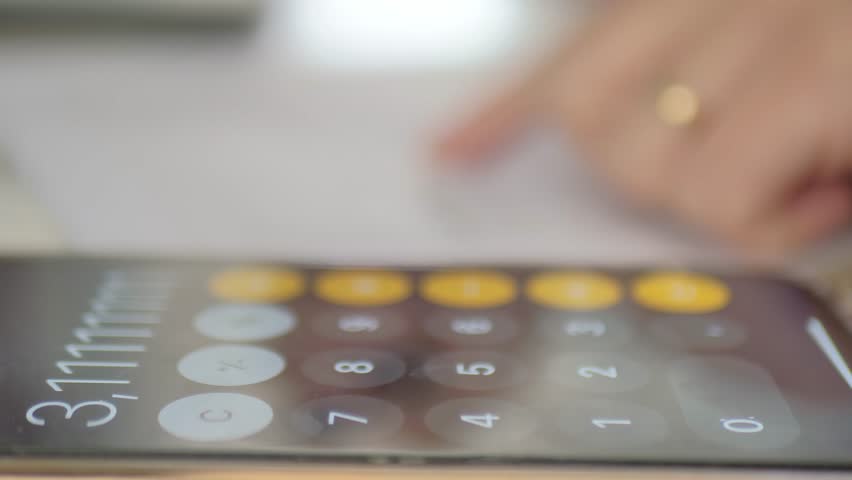 Woman use phone application to calculate bill after shopping at the supermarket. - Powered by Shutterstock - Get 15% off with code: PIKWIZARD15