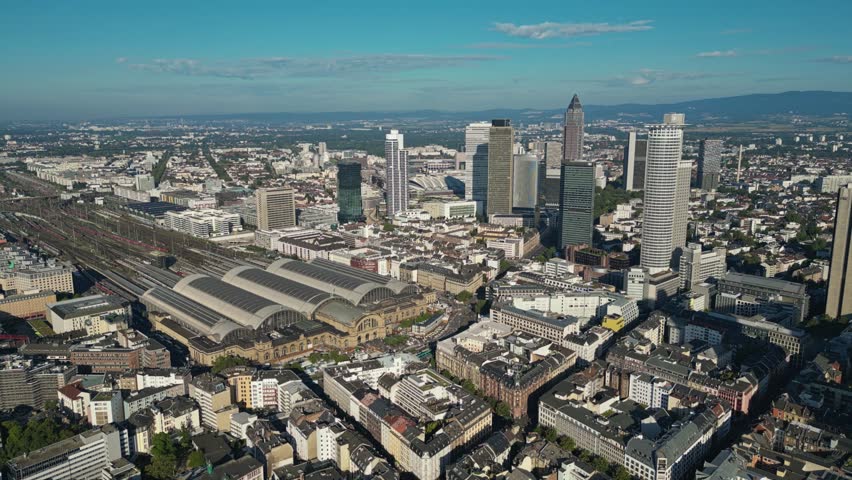 Beautiful Summer’s day in Frankfurt. City train station and buildings