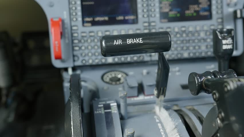 Close up shot of speed brake handle on main instrument panel in plane