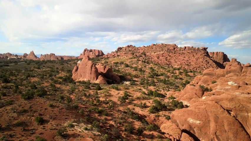 An aerial cinematic video landscape covering a wide angle of Arches National Park landscape.